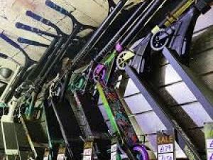 Wall rack of hanging scooters